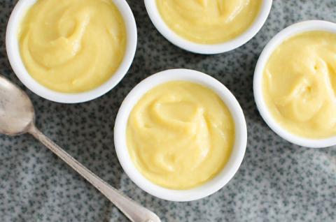 Picture of four small pots of vanilla pudding